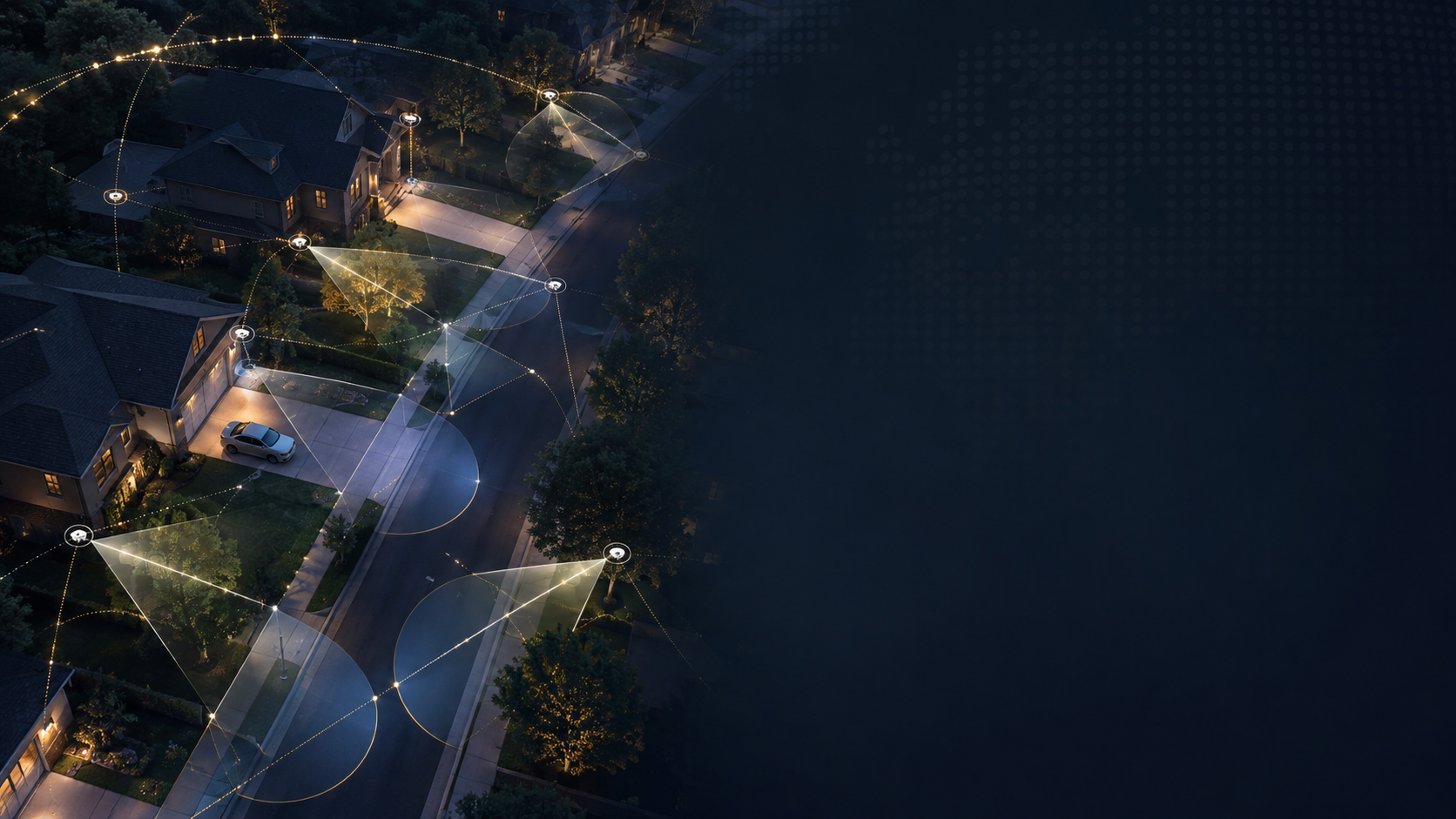 Aerial night view of a residential street where exterior cameras and lighting connect into overlapping coverage across driveways, sidewalks and front doors